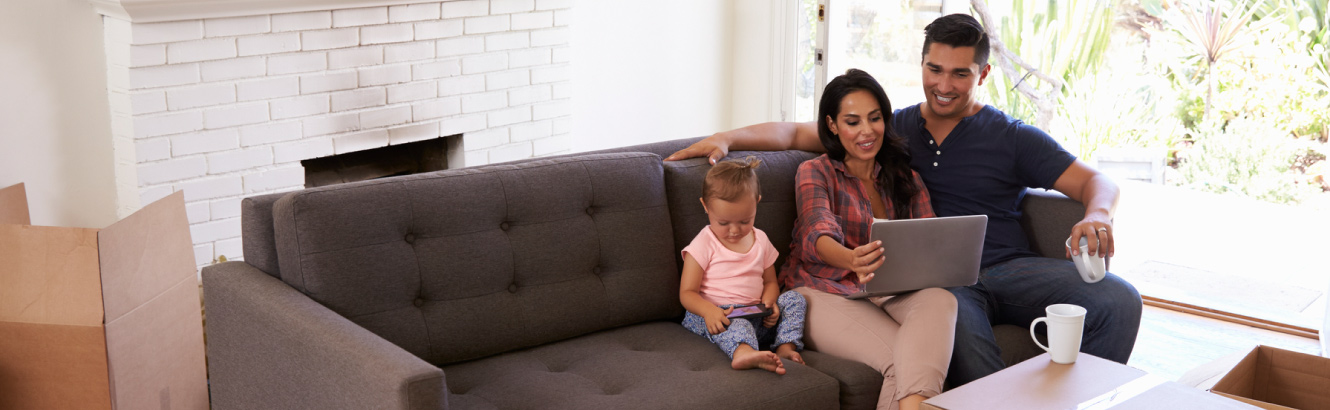 A family on the couch in a new home